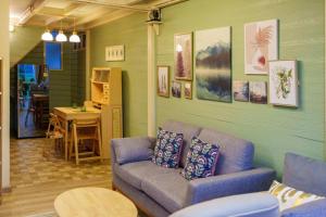 a living room with a couch and a table at Mana-An Lake Hill Resort Villa in Chiang Mai