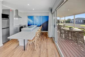 a kitchen and dining room with a table and chairs at Kilsby Sinkhole & Accommodation in Mount Schank +14 photos