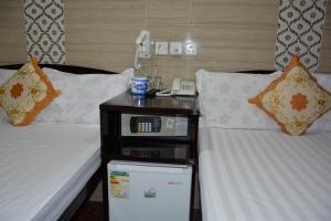Un pat sau paturi într-o cameră la Everest Hostel