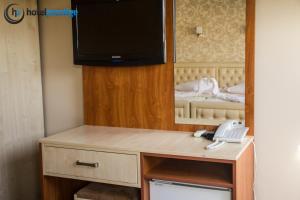 TV a/nebo společenská místnost v ubytování Hotel Prestige