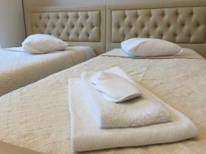 Postel nebo postele na pokoji v ubytování Hotel Prestige + 7 fotografií