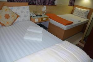 Un pat sau paturi într-o cameră la Everest Hostel