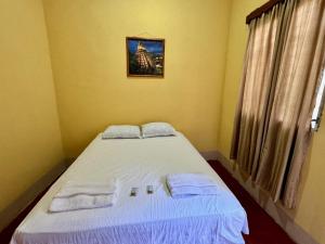 Postel nebo postele na pokoji v ubytování Hostal Los Girasoles by Hostal Inn