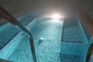 a large swimming pool with a light in the middle at Stoichkovata Kashta Koprivshtitsa in Koprivshtitsa