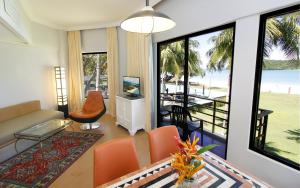a living room with a view of the ocean at Holiday Villa Resort & Beachclub Langkawi in Pantai Cenang