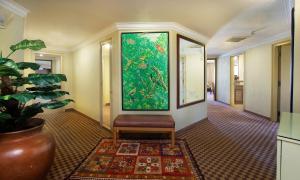 a hallway with a large painting on the wall at Holiday Villa Resort & Beachclub Langkawi in Pantai Cenang
