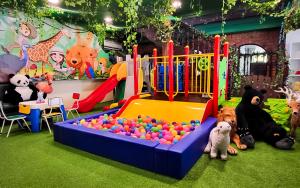 a group of stuffed animals sitting next to a playground at Holiday Villa Resort & Beachclub Langkawi in Pantai Cenang