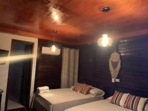 Postel nebo postele na pokoji v ubytování Hotel Quiloma Ranch