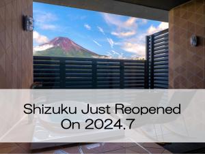 a sign that reads shikyu just reopened on a window at Mt Fuji View and Private Sauna Ryokan Shizuku in Yamanakako