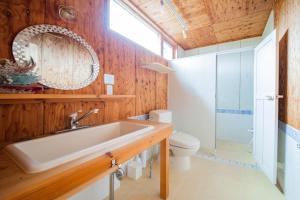 a bathroom with a sink and a toilet at FamC in Nakafurano