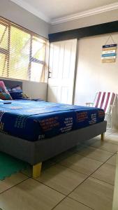 Ένα ή περισσότερα κρεβάτια σε δωμάτιο στο SummerPlace Guest Rooms