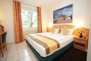 Postel nebo postele na pokoji v ubytování UNO Hotel Posthof Saarlouis