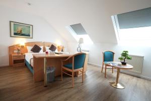 Postel nebo postele na pokoji v ubytování UNO Hotel Posthof Saarlouis
