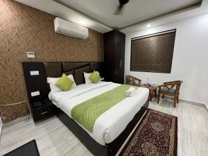 Postel nebo postele na pokoji v ubytování Hotel Royal Inn igi + 37 fotografií