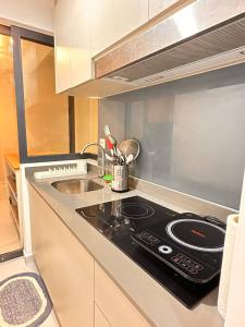 Kuchyň nebo kuchyňský kout v ubytování Apartment in Batu Kawan