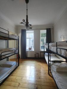 Voodi või voodid majutusasutuse Ambience Hostel & Apartments toas