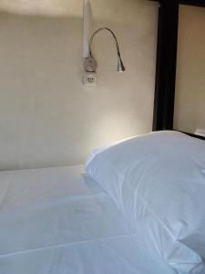 Voodi või voodid majutusasutuse Ambience Hostel & Apartments toas