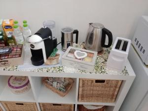A kitchen or kitchenette at Antonella home b&b
