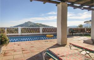 a patio with a view of a mountain at 2 Bedroom Amazing Home In Frigiliana in Frigiliana