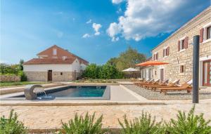a house with a swimming pool next to a building at Four-Bedroom Holiday Home In Citluk in Čitluk +36 photos