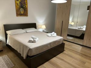Posteľ alebo postele v izbe v ubytovaní Seaside apartments Casa CARLA e Casa ANDREA