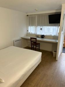 Postel nebo postele na pokoji v ubytování Kyriad Direct Metz Nord – Woippy