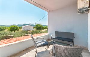 a balcony with a table and chairs and a view at Lovely Home In Stankovci With Wifi in Stankovci +22 photos