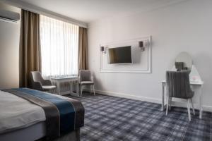 TV in/ali zabaviščno središče v nastanitvi Hotel Mio City