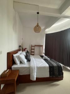 Postel nebo postele na pokoji v ubytování TUGU Bali glamping