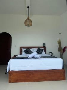 Postel nebo postele na pokoji v ubytování TUGU Bali glamping