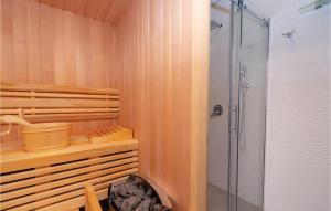 a bathroom with a walk in shower and a glass shower at Stunning Home In Zrnovo With Wifi in Korčula
