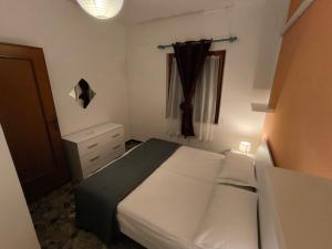 A bed or beds in a room at Casa Flavio