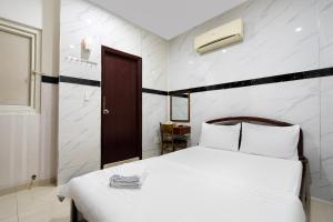 Postel nebo postele na pokoji v ubytování Lam Sơn Hotel 3 Tháng 2