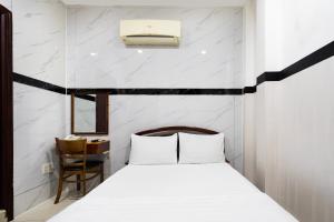 Postel nebo postele na pokoji v ubytování Lam Sơn Hotel 3 Tháng 2