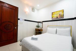 Postel nebo postele na pokoji v ubytování Lam Sơn Hotel 3 Tháng 2