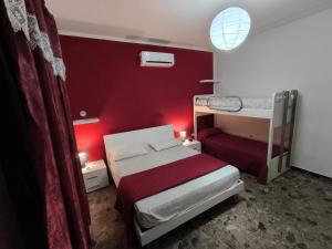 A bed or beds in a room at Casa Flavio