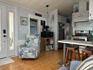 a kitchen with a chair and a kitchen table at Seaside Therapy in Myrtle Beach
