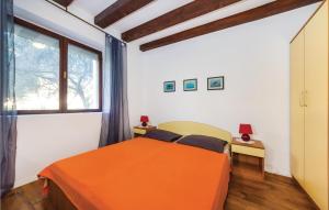 Łóżko lub łóżka w pokoju w obiekcie Holiday Home Bibinjskih Mlikaric Bb Iv