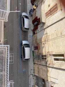 two cars parked on the side of a building at Dimora Criosa b&b in Ruvo di Puglia +6 photos