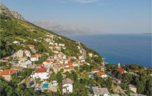 a village on a hill near the ocean at Apartment Mimice Mimice Brig Iii in Mimice
