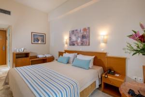 Posteľ alebo postele v izbe v ubytovaní Minos Hotel