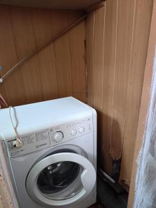 a washer and dryer in a small room at Хостел Sweet Home in Mykolaiv