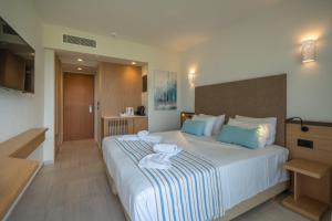 Posteľ alebo postele v izbe v ubytovaní Minos Hotel