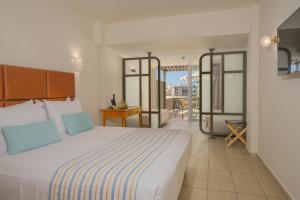 Posteľ alebo postele v izbe v ubytovaní Minos Hotel