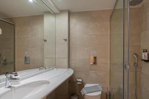 Kúpeľňa v ubytovaní Minos Hotel