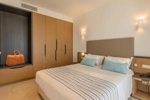 Posteľ alebo postele v izbe v ubytovaní Minos Hotel