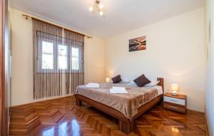 Postel nebo postele na pokoji v ubytování Two-Bedroom Holiday Home In Sokusan