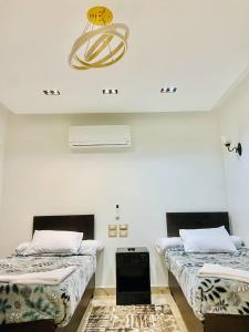 Ένα ή περισσότερα κρεβάτια σε δωμάτιο στο Summer Land Hotel