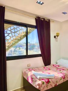 Ένα ή περισσότερα κρεβάτια σε δωμάτιο στο Summer Land Hotel