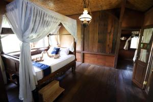 Postel nebo postele na pokoji v ubytování Katumbiri Resort